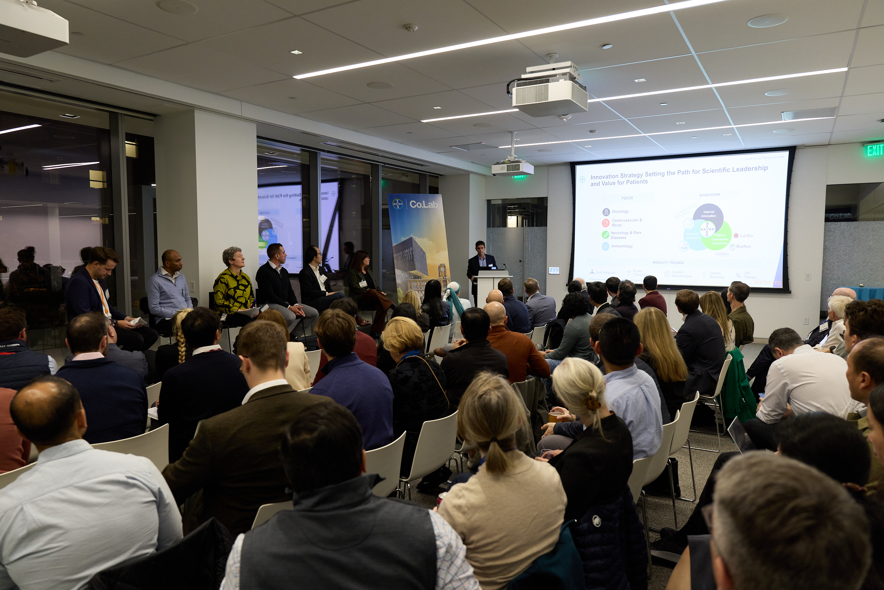 a group of entrepreneurs and scientists having an outdoor meeting at a Bayer co.lab healthcare innovation lab